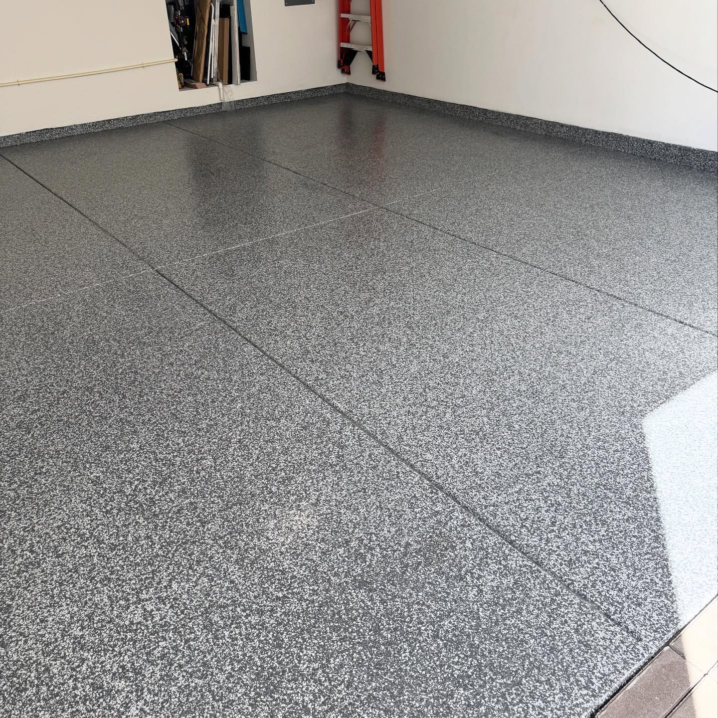 Grey decorative chip epoxy garage floor